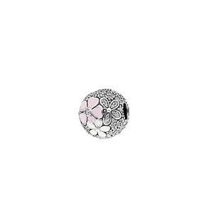 Detailed close-up of a flower charm bead with pink enamel and sparkling crystals