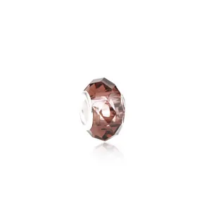 Macro detail of dark pink faceted crystal bead with silver metal core for DIY bracelets