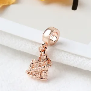 Detailed close-up of rose gold castle charm with intricate towers for bracelets