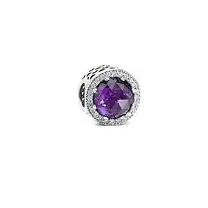 Silver charm featuring a large faceted purple stone and white crystal halo