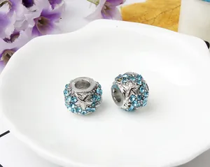 Detailed macro view of starfish charm bead with blue rhinestones for DIY bracelets