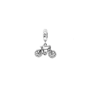 Detailed view of silver bicycle charm with sparkling cubic zirconia on wheels