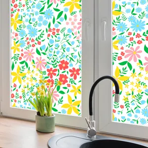 Detail of floral static window film with colorful blossoms on a white glass frame