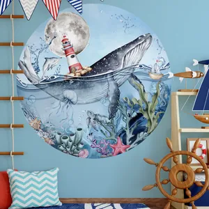 Detailed nautical wall decal featuring a whale, lighthouse, and ocean life in a nursery setting