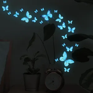 Luminous blue butterfly wall decals glowing in dark room for nursery wall decor