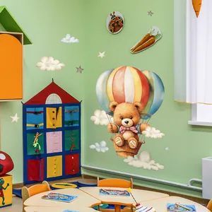 Detail of teddy bear in hot air balloon wall decal with stars and clouds for kids room