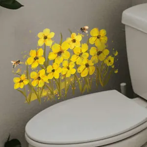 Detalle de adhesivos decorativos de flores amarillas y abejas en pared de baño