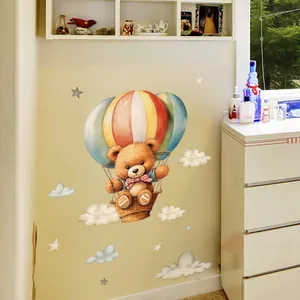 Cartoon brown bear in striped hot air balloon wall sticker with stars and clouds