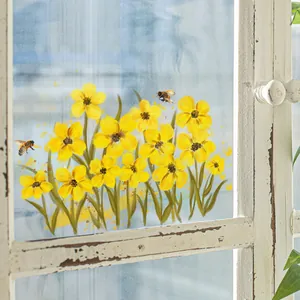Pegatinas de pared de flores amarillas y abejas en un marco de madera blanca