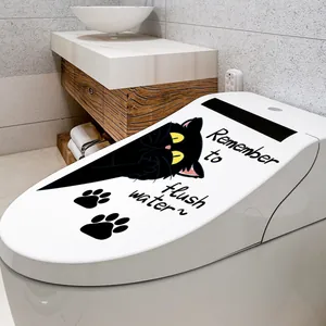 Detail von schwarzem Katzen-Toilettenaufkleber mit Text Remember to flush water in Weiß