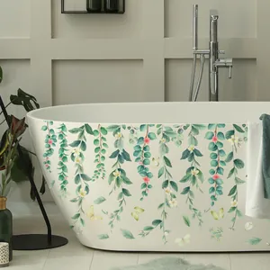 Waterproof green vine wall decals with flowers and butterflies on a white bathtub