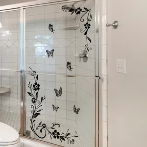 Minimalist black floral butterfly wall decals on glass bathroom door mirror