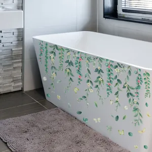 Floral vine wall sticker with green leaves and butterflies on a white bathtub surface