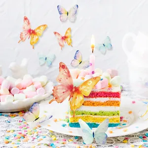 Close-up of vibrant 3D paper butterflies on a rainbow cake for party decorations