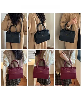 Crocodile pattern handbags for women in black and burgundy with dual handle detail