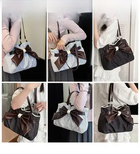 Detailed views of polka dot tote bag with large leather bow and lace trim details