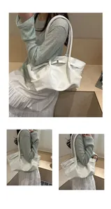Detail showing glossy white pleated leather tote with an elegant golden square buckle