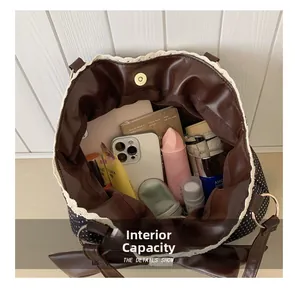 Internal capacity of the polka dot tote bag showing space for cosmetics and essentials