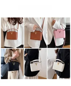 Fashionable PU leather crossbody bag with metal V-decoration shown on models in six angles