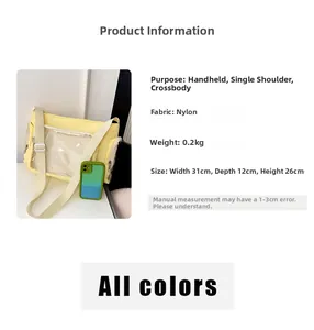 Detail view of yellow nylon tote bag dimensions 31x12x26cm with clear pocket and strap