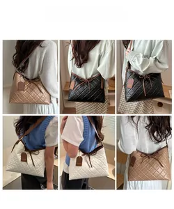 Close-up of quilted tote bags featuring bow details and fashion brand hanging tags