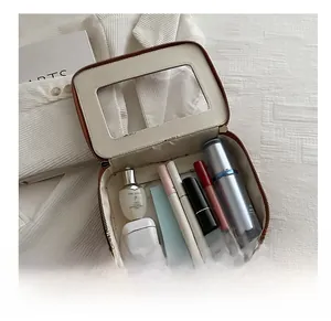 Détail de la trousse de maquillage crème à grande capacité avec fenêtre intérieure en PVC