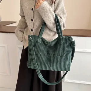 Large dark green corduroy tote bag with TOTE BAG embroidery and adjustable shoulder strap