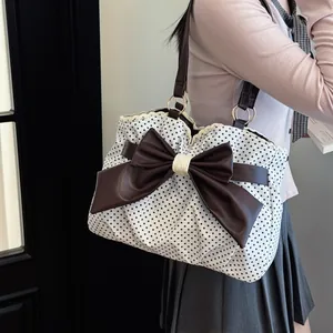 White polka dot shoulder bag with large brown bow and lace trim for women's fashion