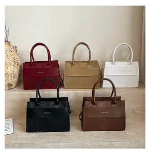 Detailed arrangement of structured crocodile pattern handbags in five elegant colors