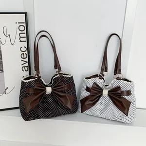 Polka dot tote bags with large brown faux leather bows and ruffled lace edges
