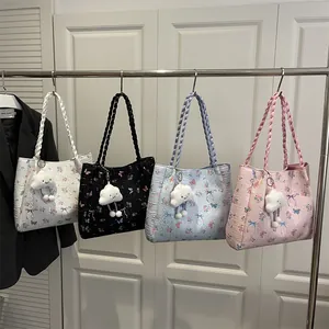 Floral print tote bags in four colors with braided handles and cloud plush pendants