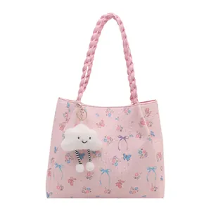 Pink floral tote bag with cloud charm and woven handles for daily commute fashion