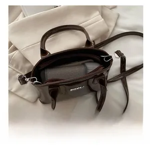 Internal view of the brown patent leather tote bag showing spacious capacity for items