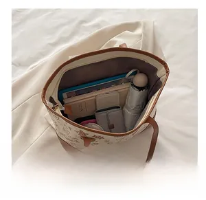 Top view of large tote bag showing interior storage for tablets, books and essentials