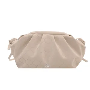 Fashionable beige pleated cloud bag with hexagonal quilting and slim leather strap