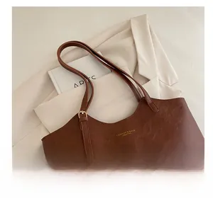 Detailed macro view of brown faux leather texture with elegant golden lettering details