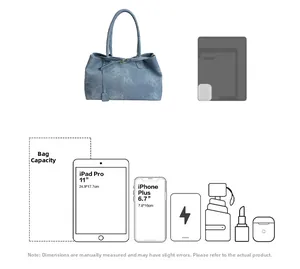 Detailed capacity view of denim tote bag showing fit for 11-inch iPad Pro and daily essentials