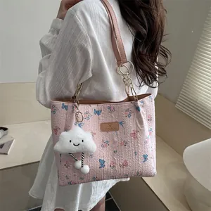 Pink butterfly tote bag for women featuring floral prints and a plush cloud charm