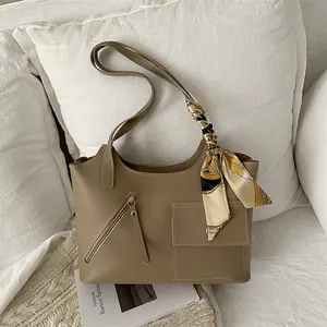 Khaki bucket tote bag with printed silk ribbon handle and utility front pockets