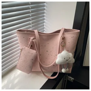 Pink tote bag set with silver star patterns, matching pouch and plush cloud charm detail