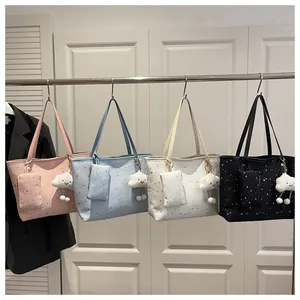 Row of colorful tote bags with star patterns and plush cloud charms in various colors