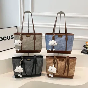 Suede tote bags in four colors with leather handles and white cloud plush charms