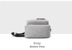 Detailed bottom view of the gray oxford fabric texture on this casual crossbody chest bag