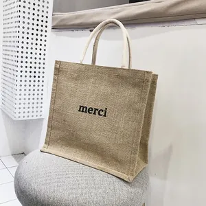 Grande borsa tote in juta naturale con stampa merci e manici in corda di cotone morbida