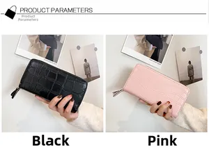 Close-up of long zip wallets in black and pink with elegant crocodile leather texture