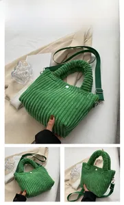 Close-up of green corduroy bucket bag texture with adjustable strap and button detail