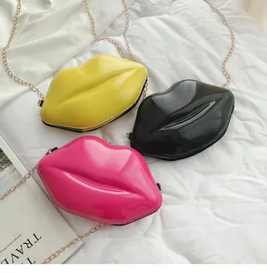 Lip-shaped mini crossbody bags in glossy yellow, black and rose red with gold chains