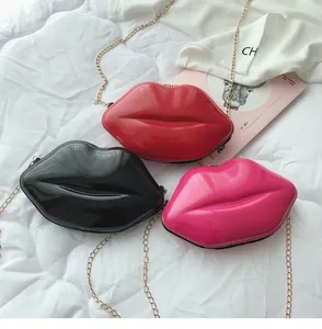 Chic lip-shaped mini chain bags in red, black and pink colors on quilted background