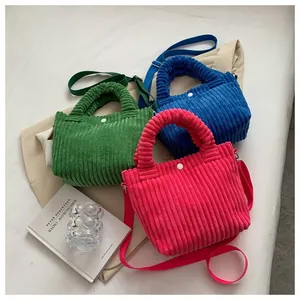 Corduroy handbag set in green, blue, and pink with adjustable straps and round handles