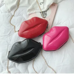 Lip-shaped chain purses in red, pink, and black featuring glossy patent leather finish